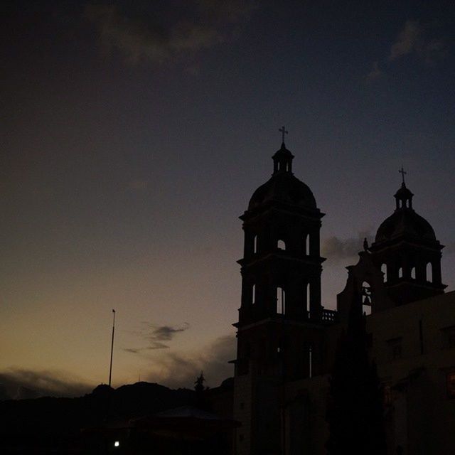 architecture, building exterior, built structure, religion, low angle view, place of worship, church, spirituality, sky, dome, silhouette, cross, high section, cloud - sky, dusk, street light, outdoors, no people