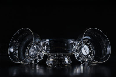 Close-up of glass bowls against black background