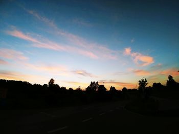 Silhouette trees against sky during sunset