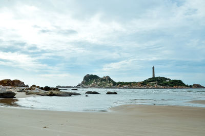 Scenic view of beach against sky