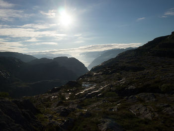 Scenic view of mountains against cloudy sky