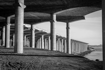 Bridge over sea against sky