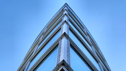 Low angle view of building against clear blue sky