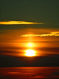 Scenic view of sea against romantic sky at sunset