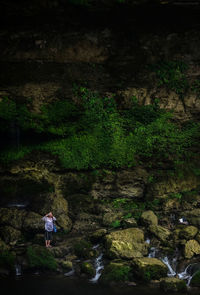 Woman standing on rock