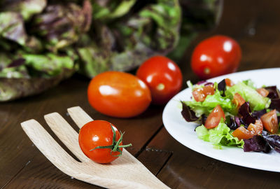Close-up of fresh vegetables on rustic wooden table