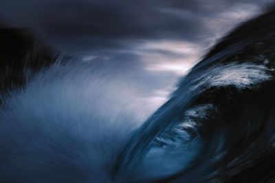 Wave breaking with slow exposure under clouds