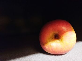 Close-up of apple against black background