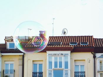 Low angle view of multi colored buildings against clear sky