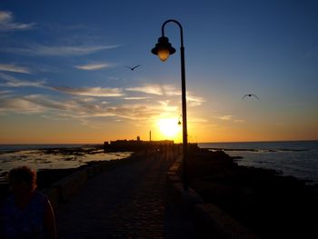 Scenic view of calm sea at sunset