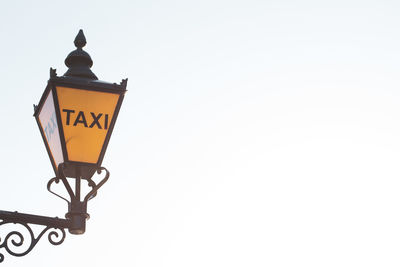 Low angle view of street light against clear sky