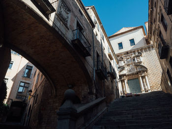 Low angle view of old buildings in town