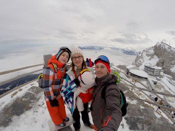 High angle view of people skiing on snow covered mountain