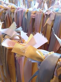 Close-up of clothes hanging on paper at market stall