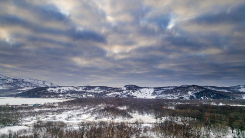 Scenic view of snowcapped mountains against sky