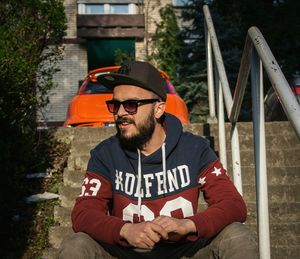 Portrait of man sitting outdoors