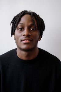 Young black man wearing jumper studio portrait