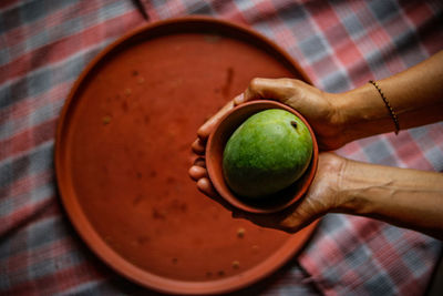 High angle view of man holding slice