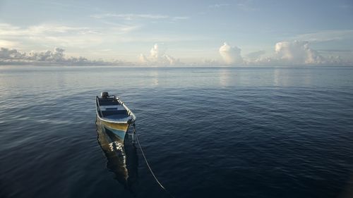 Boat in sea against sky