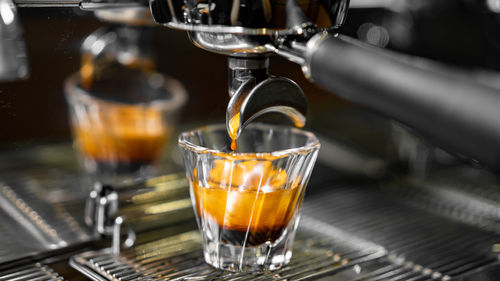 Close-up of coffee light candle in glass