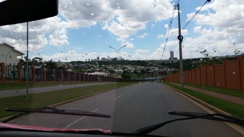 View of road against cloudy sky