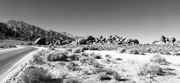 Panoramic view of road amidst landscape against clear sky