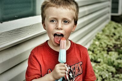 Portrait of cute girl holding ice cream