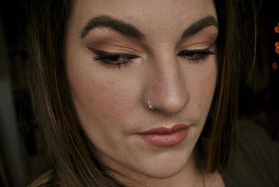 Close-up of beautiful young woman with make-up