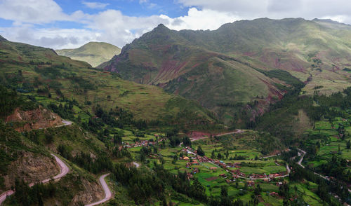 Scenic view of mountains against cloudy sky