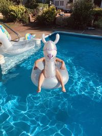 Full length of shirtless boy in swimming pool