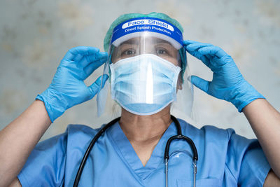 Portrait of doctor wearing face shield outdoors