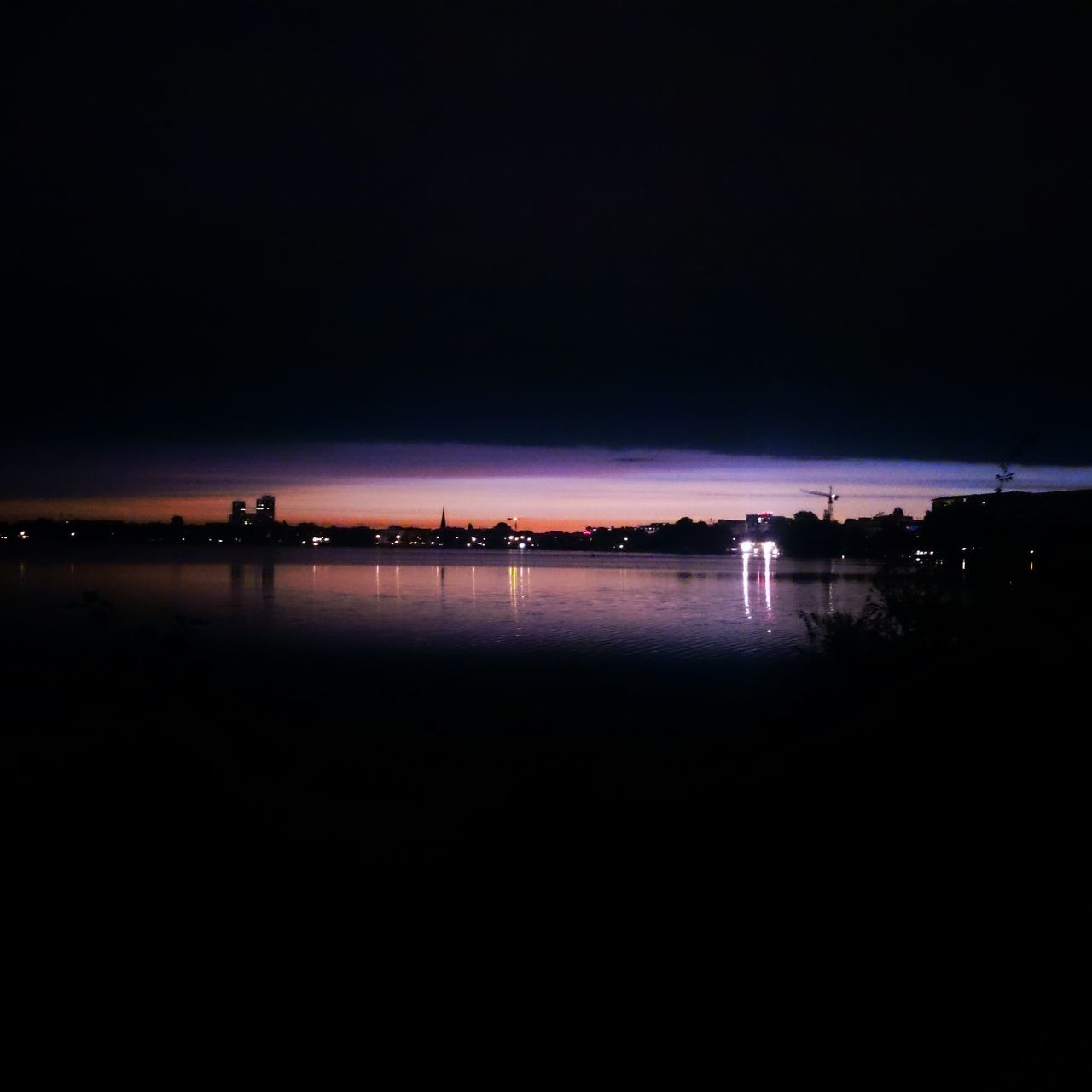 sky, water, night, illuminated, copy space, scenics - nature, tranquility, nature, tranquil scene, beauty in nature, sea, no people, waterfront, idyllic, outdoors, silhouette, architecture, reflection, dark