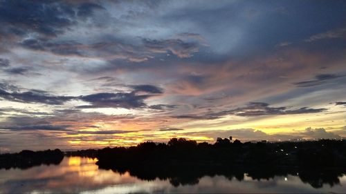 Scenic view of lake against sky during sunset