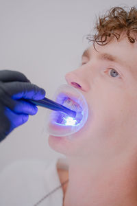 Close-up of boy blowing bubbles