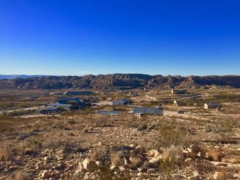 Scenic view of landscape against clear blue sky