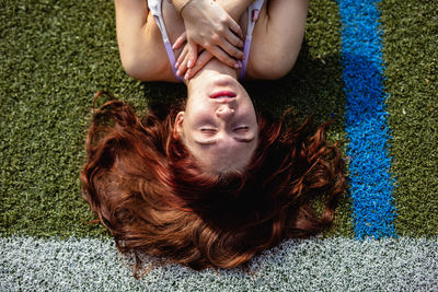 Woman sleeping on field