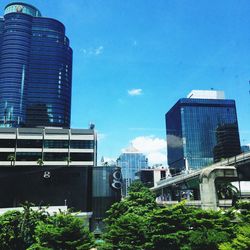 Low angle view of modern buildings against sky