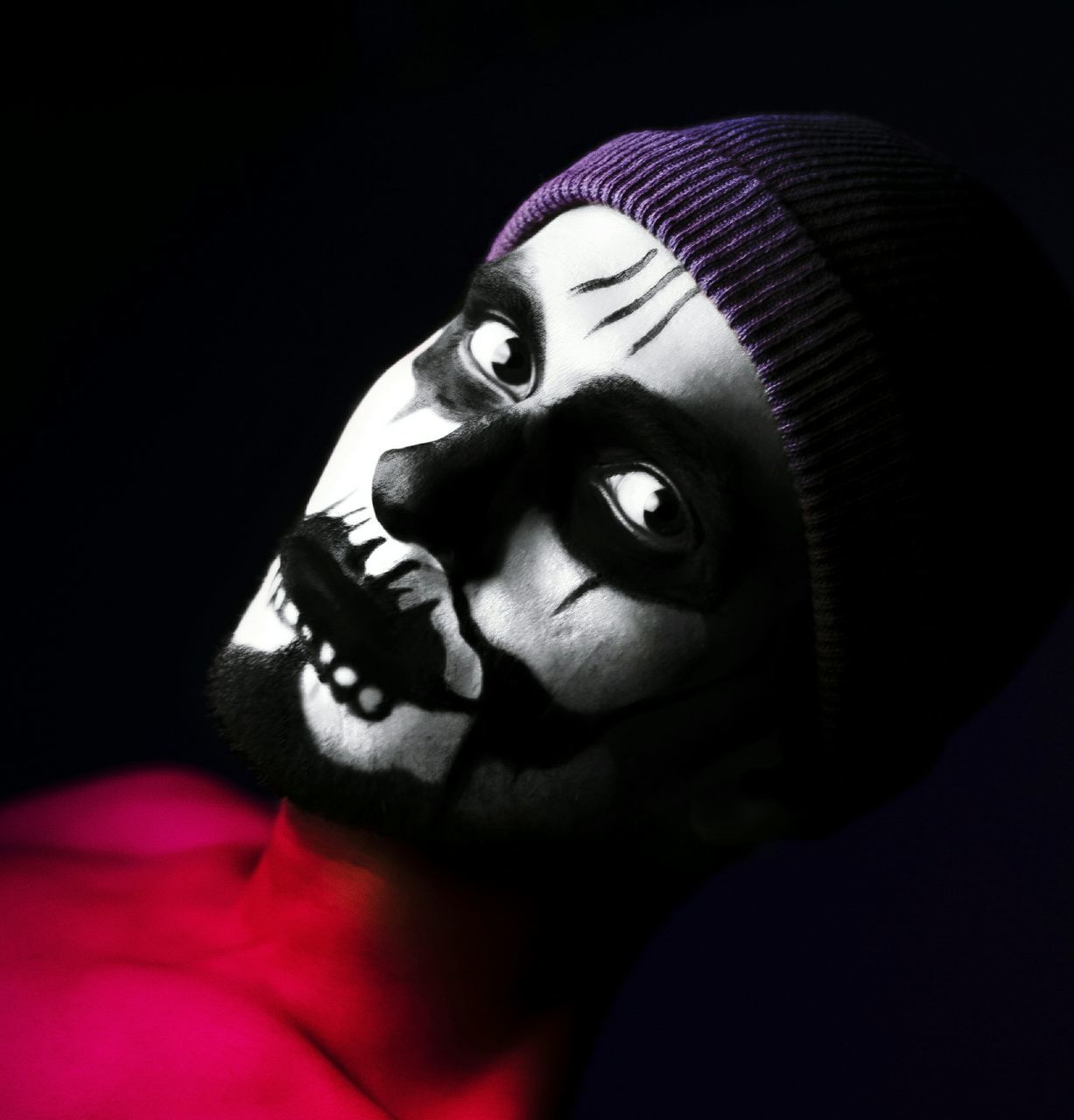 clown, black background, close-up, indoors, no people, day