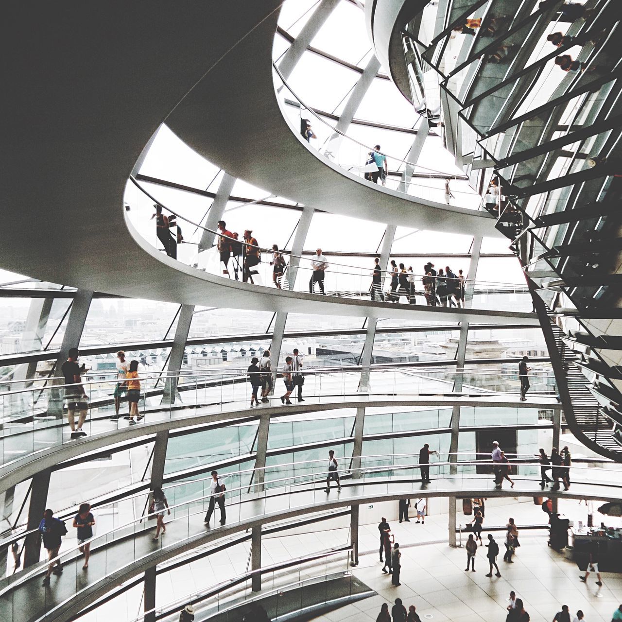 large group of people, architecture, built structure, men, person, lifestyles, indoors, leisure activity, mixed age range, walking, staircase, travel, city life, steps, low angle view, railing, high angle view, tourist, steps and staircases