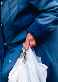 Close-up of man holding umbrella