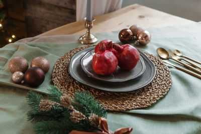 Serving a festive christmas table in scandinavian style. decor on the table before the holiday