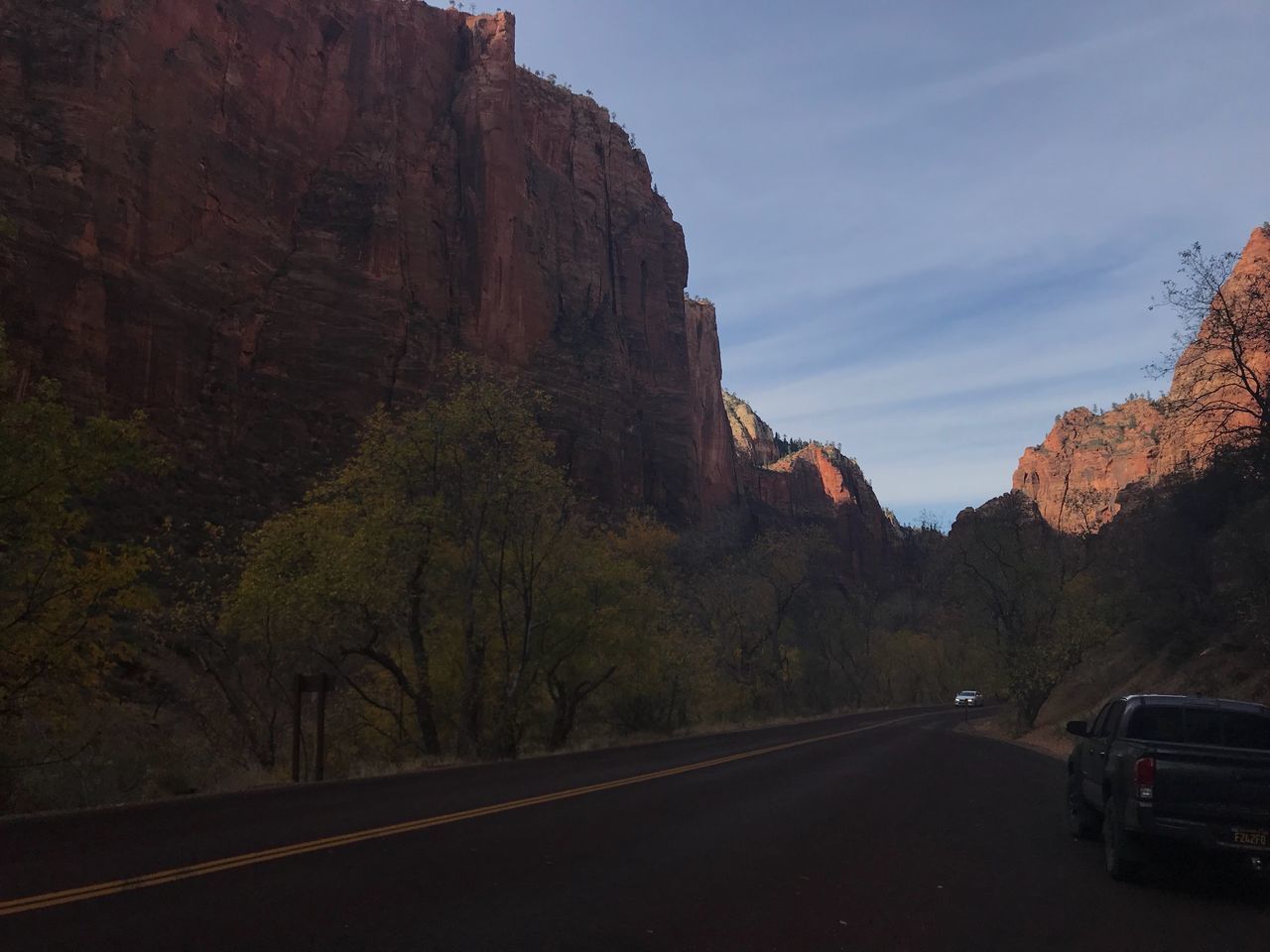 VIEW OF ROAD PASSING THROUGH MOUNTAINS