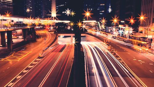 High angle view of light trails on city street at night