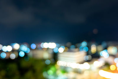 Defocused image of illuminated lights at night