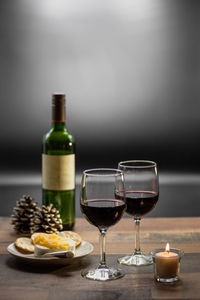 Glass of bottles on table