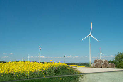 Wind turbines on field