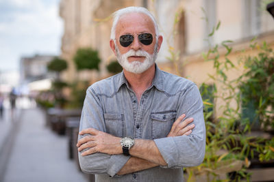 Portrait of man standing outdoors