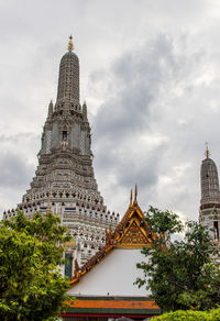 View of temple building against cloudy sky