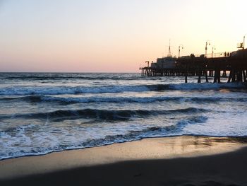 Scenic view of sea against clear sky during sunset