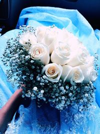 High angle view of hand holding bouquet of flower